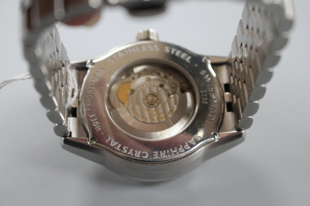 A gentlemans modern Raymond Weil stainless steel automatic wrist watch, on Raymond Weil stainless steel strap.